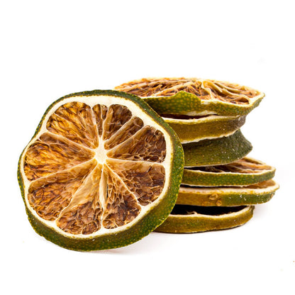 Dried lime slices on a white background