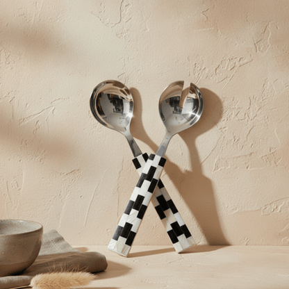Finlay Inlay serving set with checkered handles on a beige surface