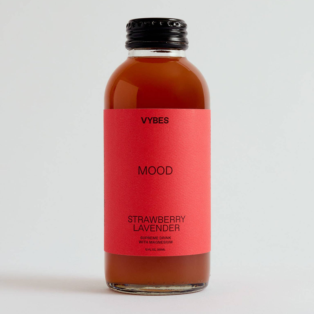 Bottle of VYBES Strawberry Lavender on a light gray background