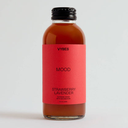 Bottle of VYBES Strawberry Lavender on a light gray background