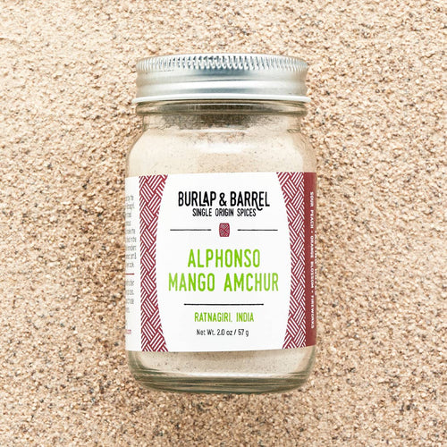 A glass jar of Burlap & Barrel Alphonso Mango Amchur spice