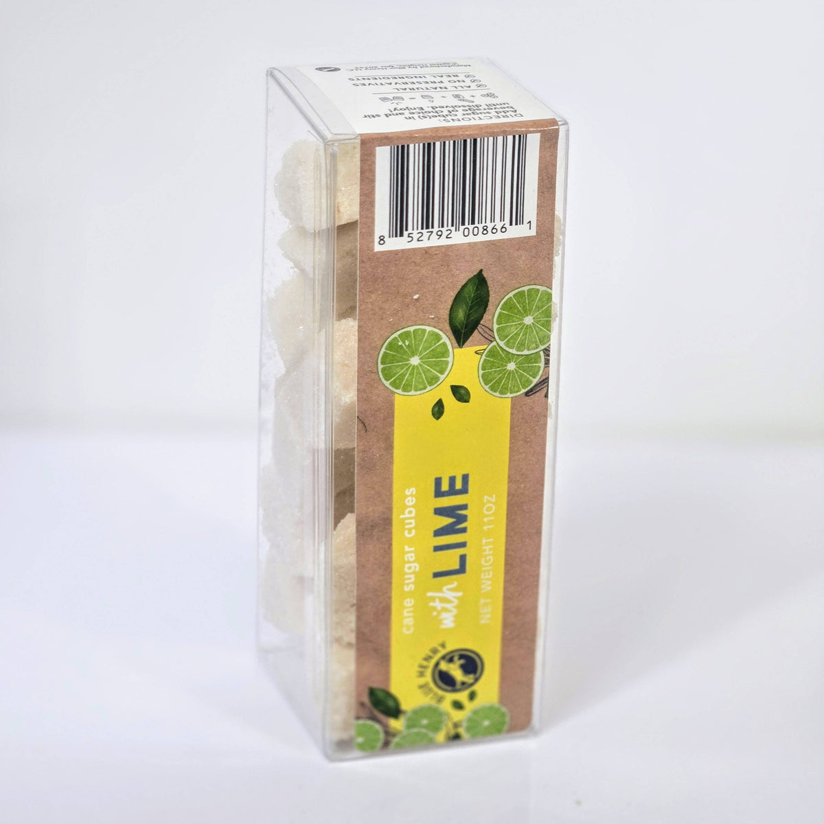 A package of lime-flavored sugar cubes in a clear plastic box with a brown cardboard insert featuring green lime illustrations and a bright yellow vertical label that reads &