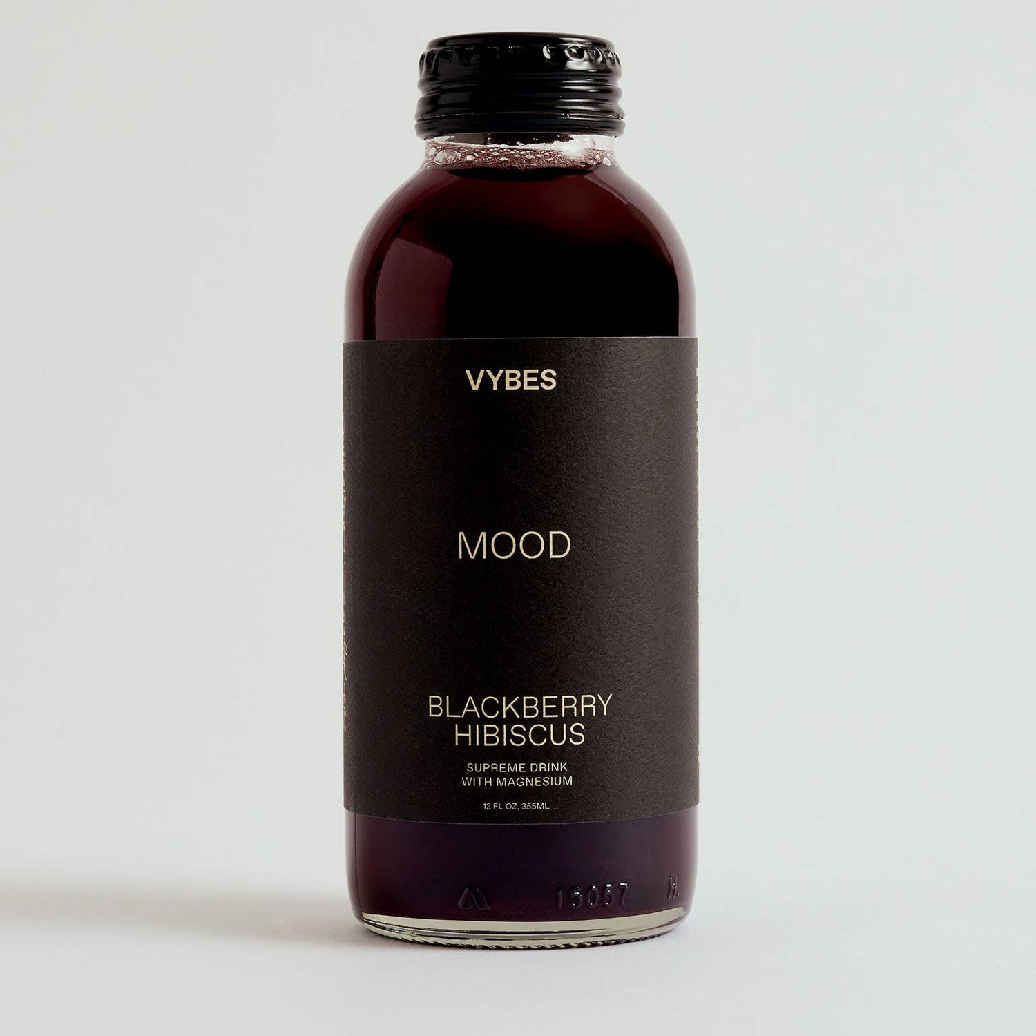 Bottle of VYBES Blackberry Hibiscus drink on a white background