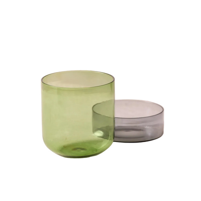 Medium glass container with lid on a white background