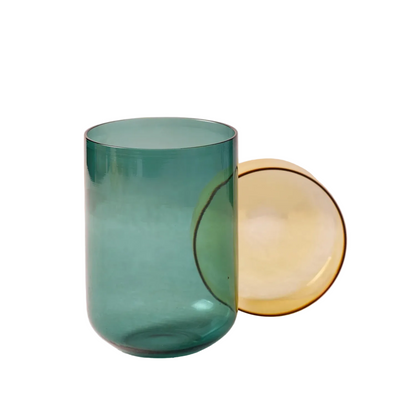 Large glass container with lid on a white background