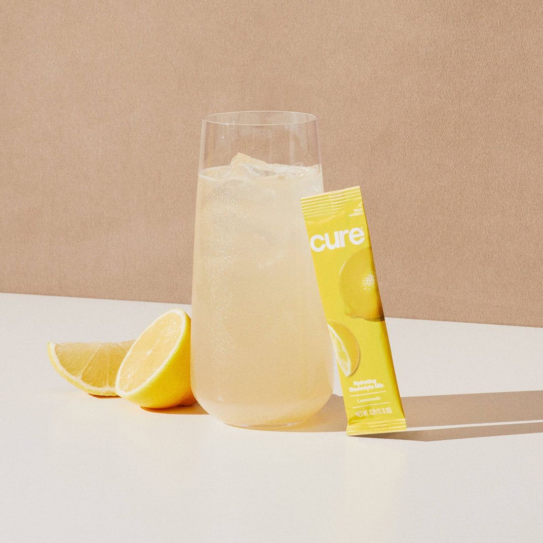 Glass of lemonade with a lemon and &