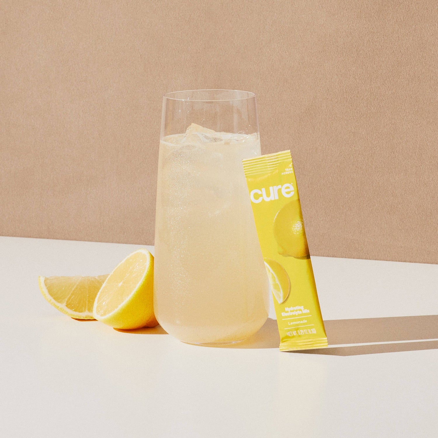 Glass of lemonade with a lemon and &