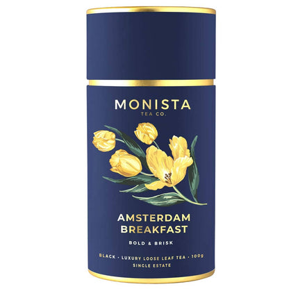 A blue Monista Tea Co. Amsterdam Breakfast black tea canister on a white background