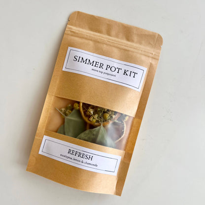 Simmer pot kit packaging with visible contents on a light background
