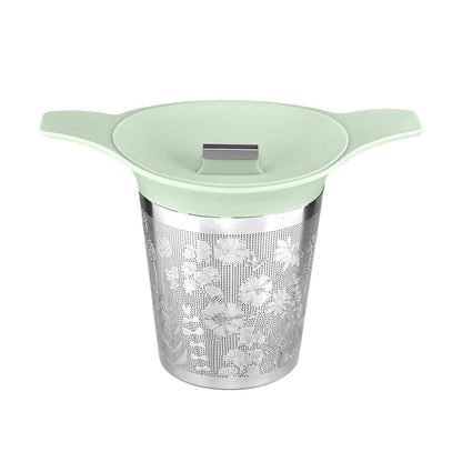 Tea infuser with floral design on a white background