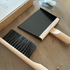 Cleaning brush and dustpan on a wooden floor