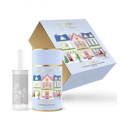 Monista French Earl Grey canister with decorative packaging featuring illustrated houses on a white background