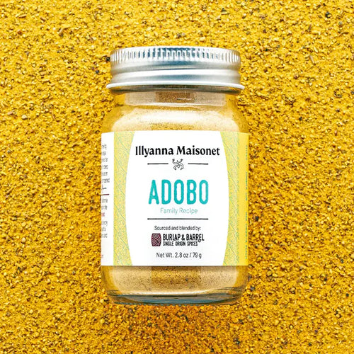 Jar of 'Adobo' seasoning with a label on a textured yellow background