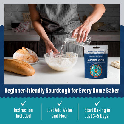 Person making bread with a package of King Arthur Flour Sourdough Starter on a kitchen counter.