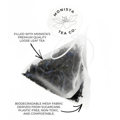 Pyramid tea bag with Monista Tea Co. branding and text about biodegradable mesh fabric.