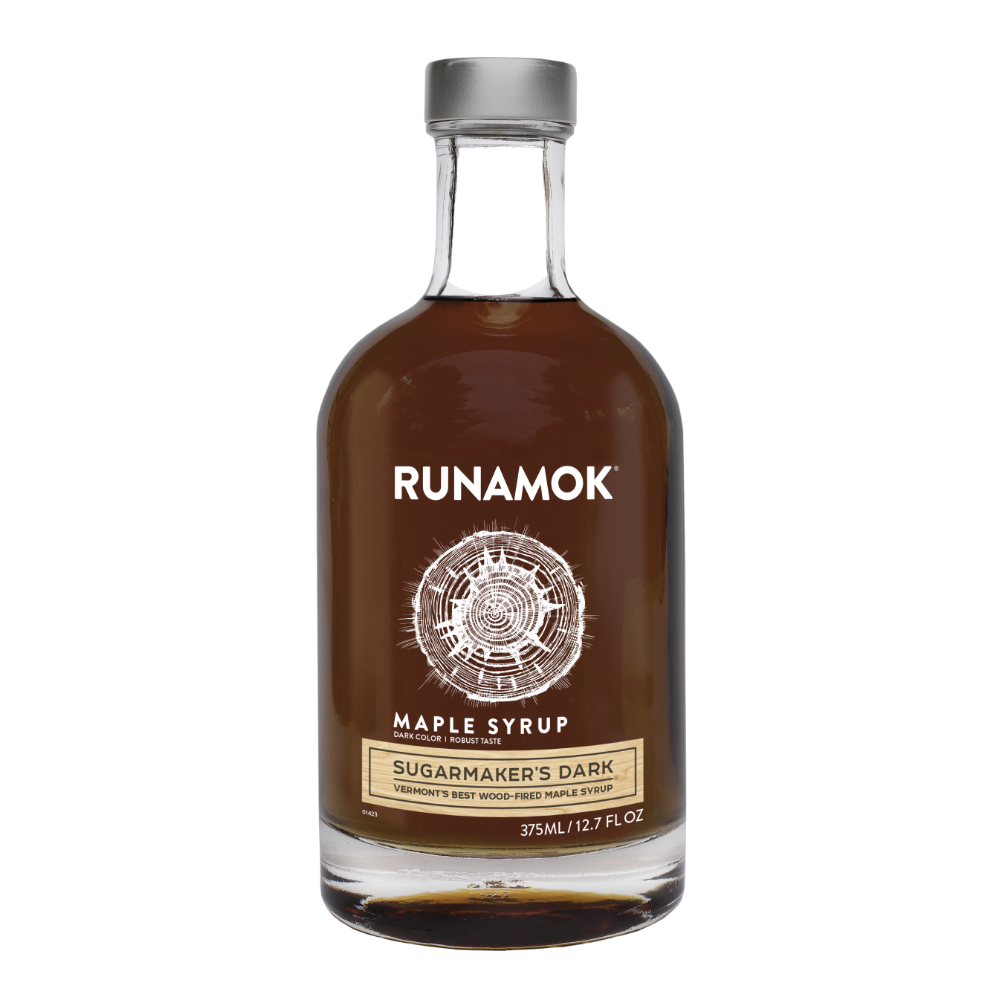 Bottle of Runamok Maple Syrup on a white background