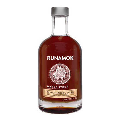 Bottle of Runamok Maple Syrup on a white background