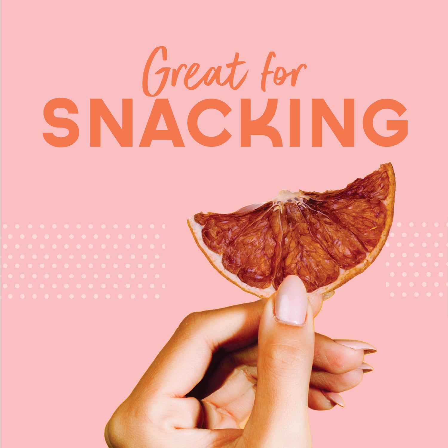 Hand holding a dried orange slice with &