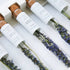 Flower tea sticks with lavender in white packaging on a light background