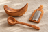 Italian olivewood bowl, cheese grater, and pasta ladle styled together
