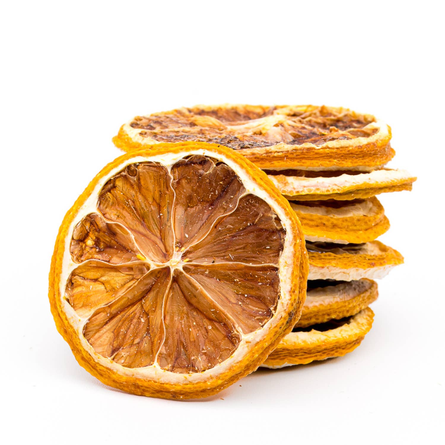 Stack of dried orange slices on a white background