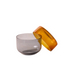 Small glass container with lid on a white background